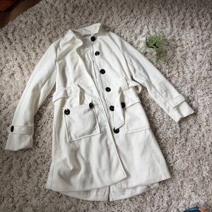 Elegant long peacoat winter coat style Ivory Trench Coat with Black Accents. Thi